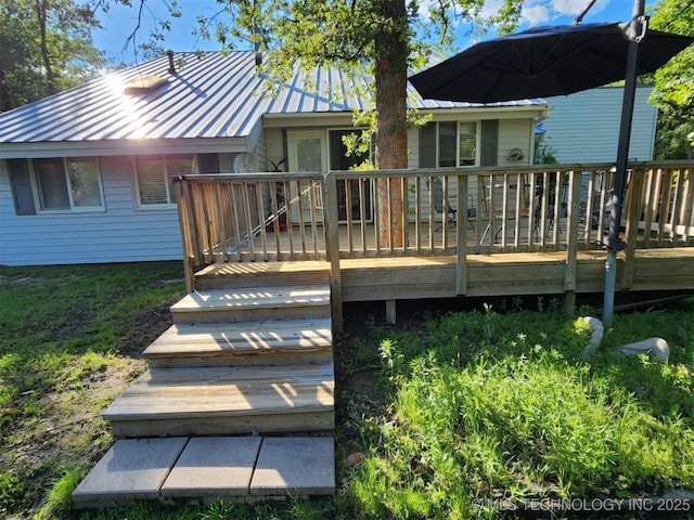 14360 County Road 3505th Loop, Ada, OK 74820 - rear view of house with metal roof, a deck, and a standing seam roof