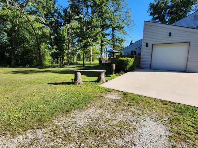 14360 County Road 3505th Loop, Ada, OK 74820 - view of grassy yard featuring driveway and a garage