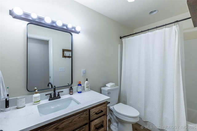 bathroom featuring toilet, vanity, and shower / bath combination with curtain
