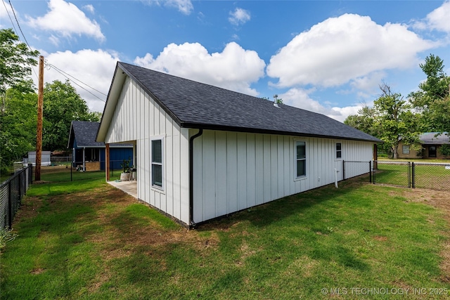 view of property exterior featuring a gate, a shingled roof, and board and batten siding