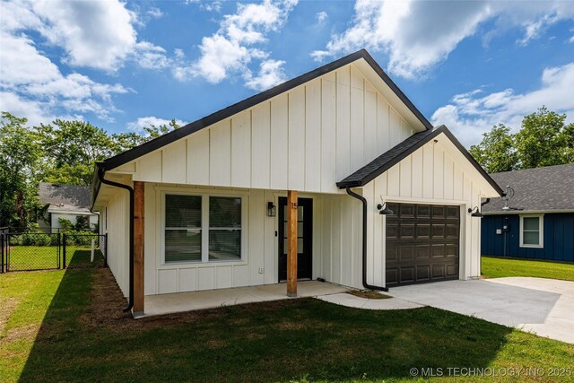 view of front of house featuring a garage, driveway, and board and batten siding
