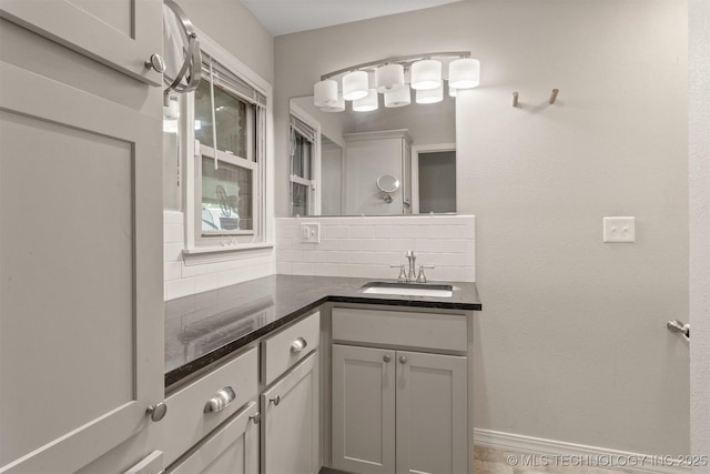 bathroom with backsplash and vanity