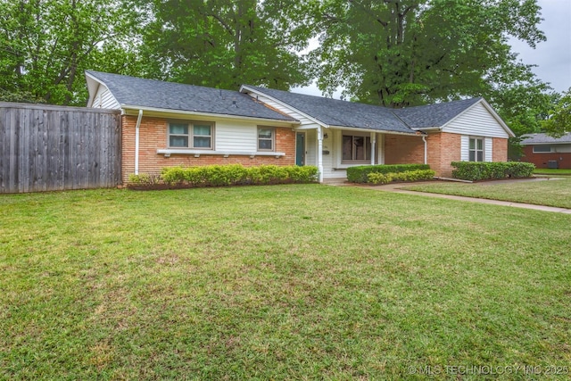 ranch-style home featuring brick siding
