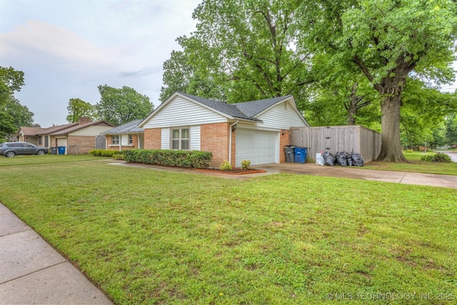 single story home with brick siding, concrete driveway, an attached garage, and a front yard