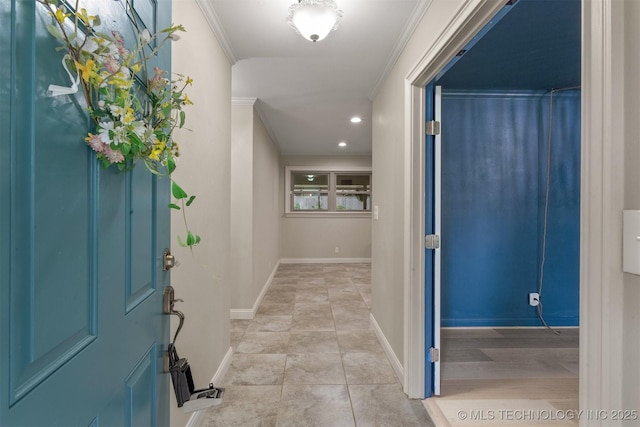 entryway featuring crown molding, baseboards, and recessed lighting