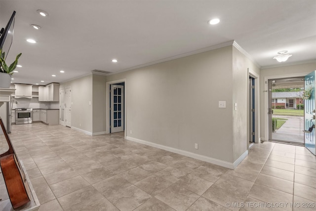 unfurnished living room with crown molding, recessed lighting, and baseboards
