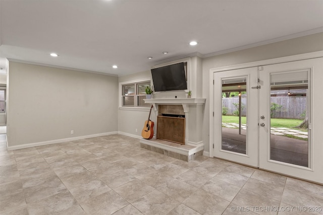 unfurnished living room featuring ornamental molding, recessed lighting, a tile fireplace, french doors, and baseboards