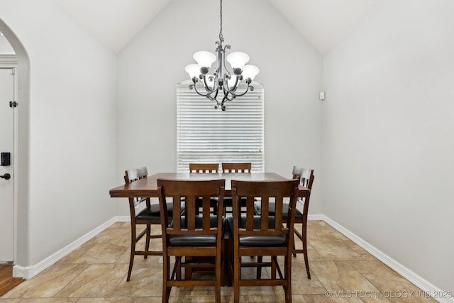 9401 N 95th E Pl, Owasso, OK 74055 - dining space featuring lofted ceiling, arched walkways, a chandelier, and baseboards