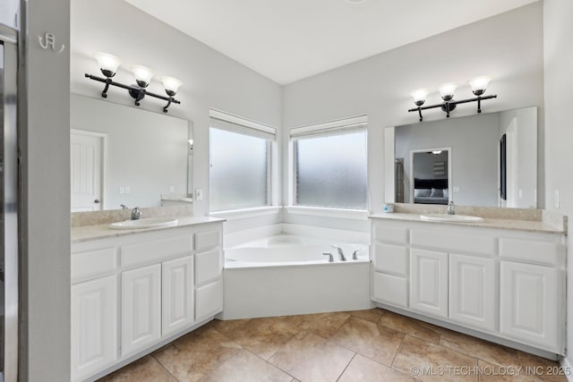 9401 N 95th E Pl, Owasso, OK 74055 - ensuite bathroom featuring two vanities, a bath, and tile patterned floors