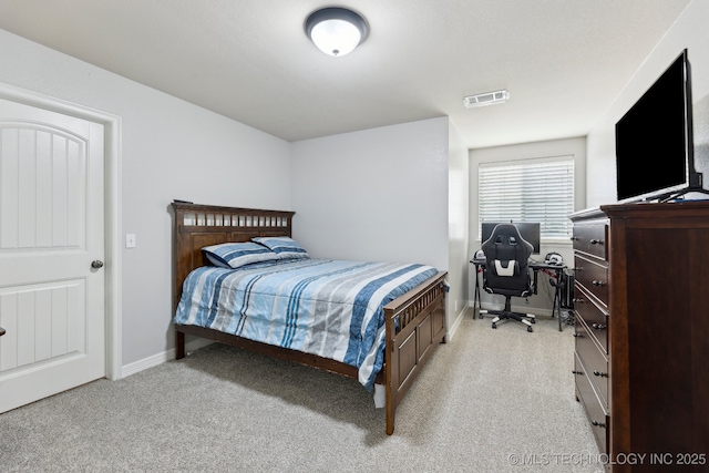 9401 N 95th E Pl, Owasso, OK 74055 - bedroom with light colored carpet, baseboards, and an office area
