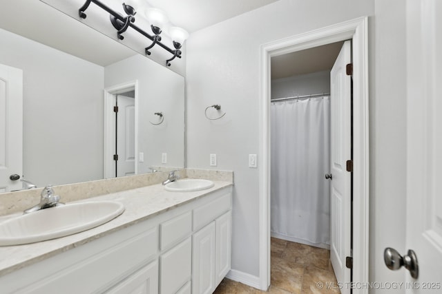 9401 N 95th E Pl, Owasso, OK 74055 - full bath with double vanity and baseboards