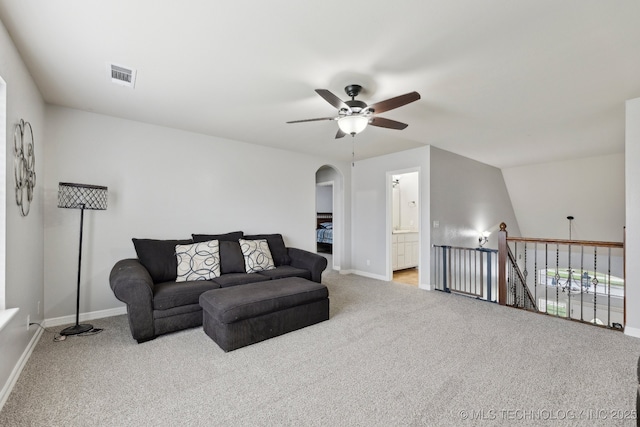 9401 N 95th E Pl, Owasso, OK 74055 - living area featuring ceiling fan, carpet floors, arched walkways, and baseboards
