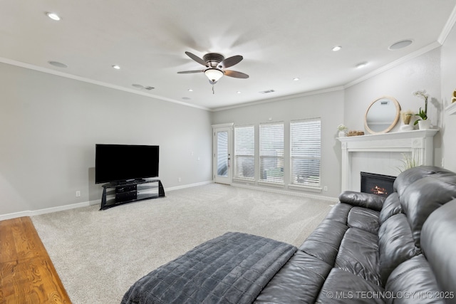 9401 N 95th E Pl, Owasso, OK 74055 - carpeted living room featuring ceiling fan, baseboards, a fireplace, recessed lighting, and crown molding