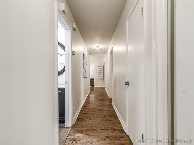 hallway with light wood finished floors and baseboards