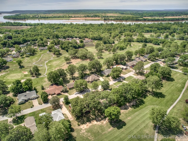 aerial perspective of suburban area featuring a nearby body of water and a local golf course