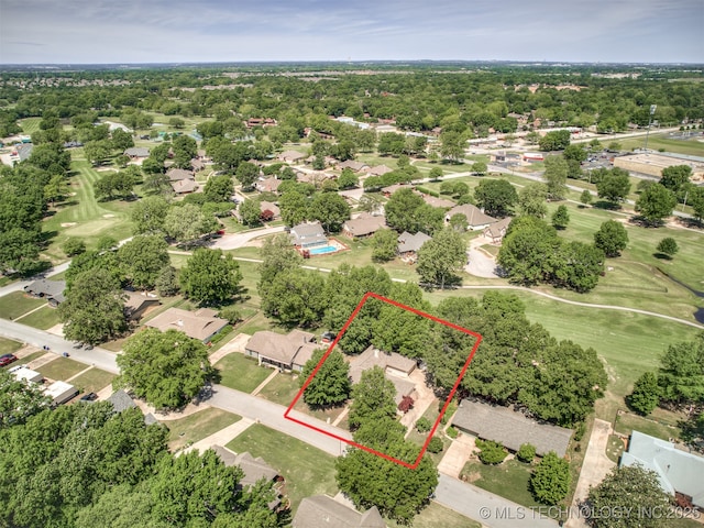 aerial view of residential area featuring property boundaries highlighted and a local golf course