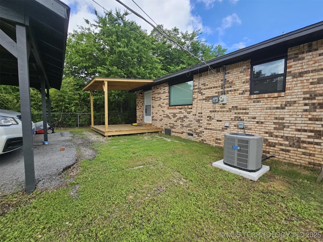 view of property exterior with cooling unit, crawl space, a deck, and brick siding