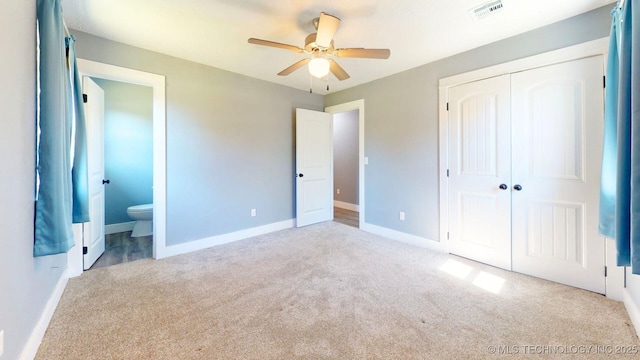 917 Fairway, Sulphur, OK 73086 - unfurnished bedroom with carpet, a closet, baseboards, ensuite bathroom, and a ceiling fan