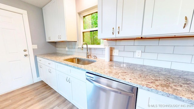 917 Fairway, Sulphur, OK 73086 - kitchen with dishwasher, a sink, white cabinetry, light stone counters, and tasteful backsplash