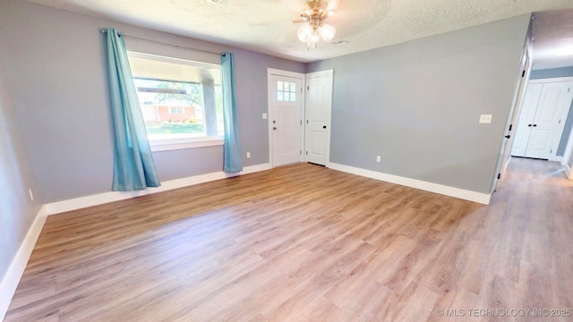 917 Fairway, Sulphur, OK 73086 - unfurnished room with baseboards, ceiling fan, and light wood finished floors