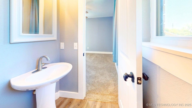 917 Fairway, Sulphur, OK 73086 - bathroom with baseboards and wood finished floors