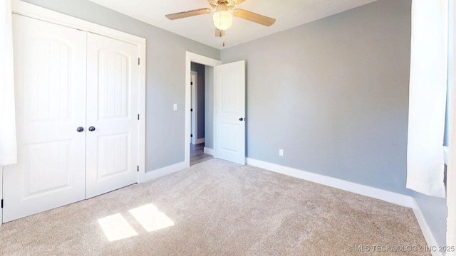 917 Fairway, Sulphur, OK 73086 - unfurnished bedroom with carpet floors, baseboards, a closet, and a ceiling fan
