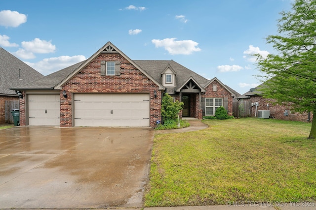 traditional-style house featuring central AC unit, brick siding, a front yard, and concrete driveway