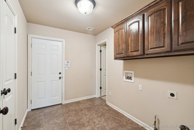 laundry room featuring hookup for an electric dryer, cabinet space, hookup for a washing machine, and baseboards