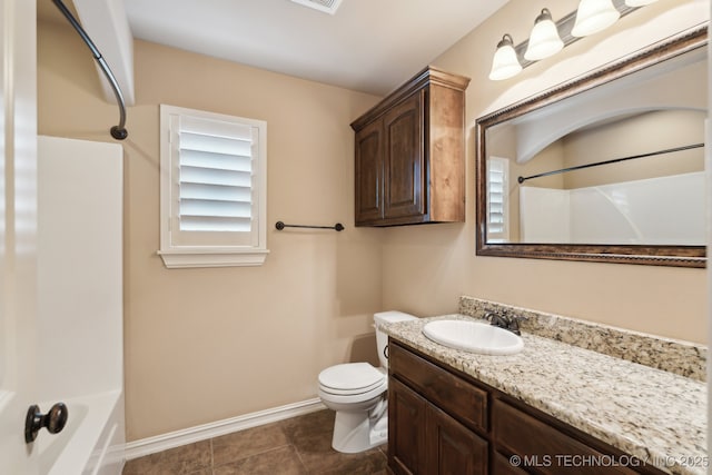 full bath featuring toilet, baseboards, vanity, bathing tub / shower combination, and tile patterned flooring