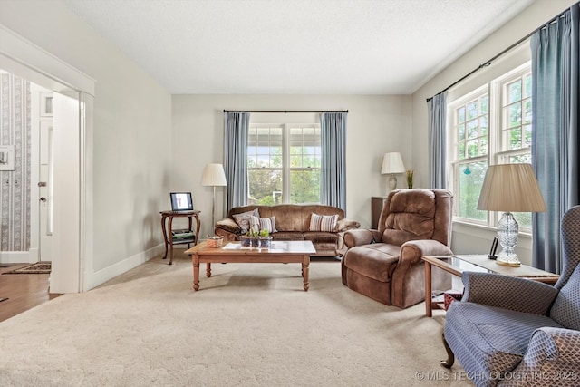 1032 E Mcleod Ave, Sapulpa, OK 74066 - carpeted living room featuring plenty of natural light