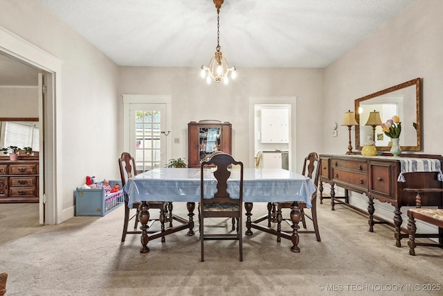 1032 E Mcleod Ave, Sapulpa, OK 74066 - dining area with light colored carpet and a chandelier