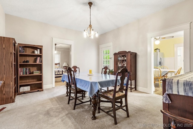 1032 E Mcleod Ave, Sapulpa, OK 74066 - dining area with carpet flooring and a chandelier
