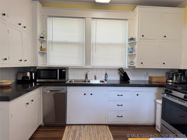 1032 E Mcleod Ave, Sapulpa, OK 74066 - kitchen featuring stainless steel appliances, open shelves, white cabinetry, and decorative backsplash