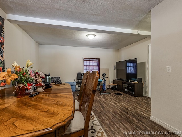 940 N Ross Ave, Dewey, OK 74029 - dining room featuring wood finished floors, a textured ceiling, beamed ceiling, and baseboards