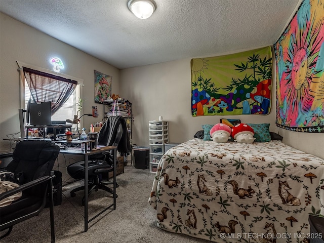 940 N Ross Ave, Dewey, OK 74029 - carpeted bedroom with a textured ceiling and a desk