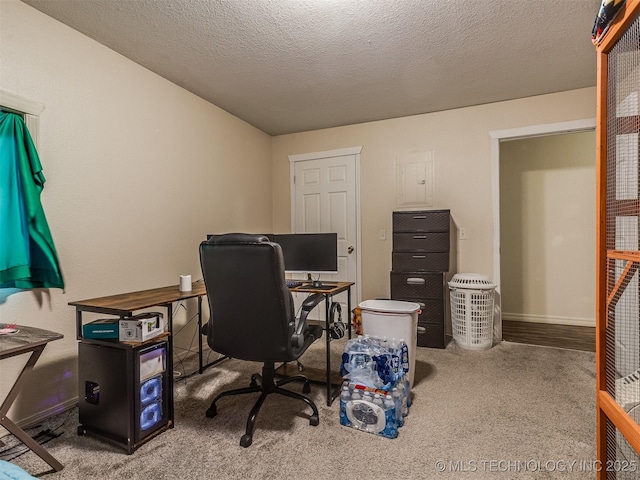 940 N Ross Ave, Dewey, OK 74029 - home office featuring carpet flooring, baseboards, and a textured ceiling