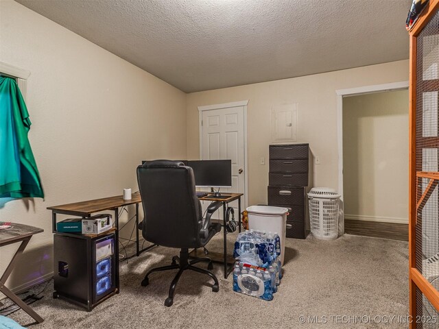 940 N Ross Ave, Dewey, OK 74029 - home office featuring carpet flooring, baseboards, and a textured ceiling