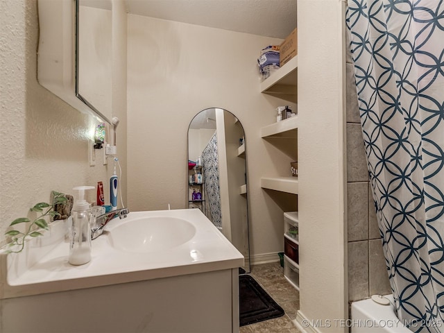 940 N Ross Ave, Dewey, OK 74029 - full bath featuring vanity and shower / bath combo with shower curtain