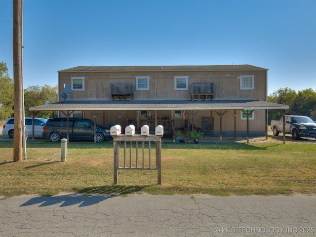 940 N Ross Ave, Dewey, OK 74029 - farmhouse-style home featuring a front lawn and covered porch