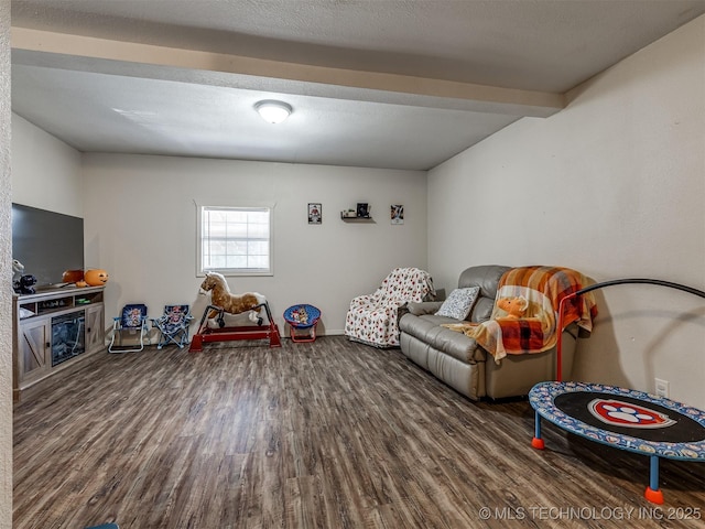 940 N Ross Ave, Dewey, OK 74029 - game room featuring wood finished floors, beamed ceiling, and baseboards