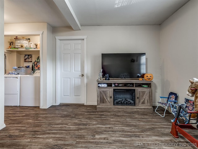 940 N Ross Ave, Dewey, OK 74029 - living area featuring separate washer and dryer, wood finished floors, and baseboards