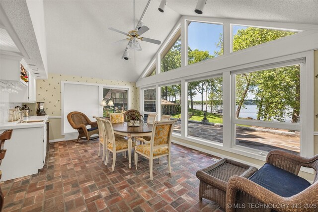 3112 Shore Dr, Grove, OK 74344 - sunroom with lofted ceiling and a water view