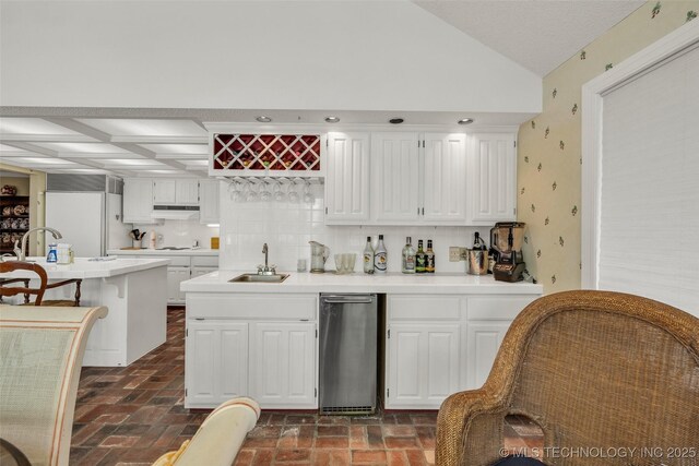 3112 Shore Dr, Grove, OK 74344 - kitchen featuring a sink, white cabinets, light countertops, and vaulted ceiling