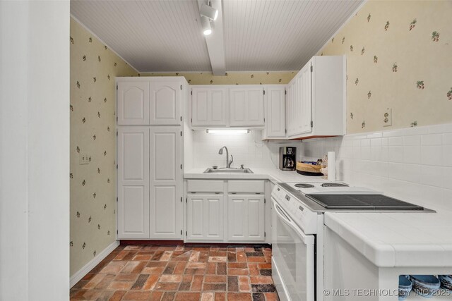 3112 Shore Dr, Grove, OK 74344 - kitchen featuring white electric range oven, a sink, tile counters, wallpapered walls, and brick flooring