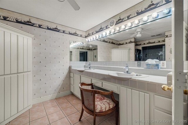 3112 Shore Dr, Grove, OK 74344 - bathroom featuring a ceiling fan, wallpapered walls, tile patterned floors, double vanity, and baseboards
