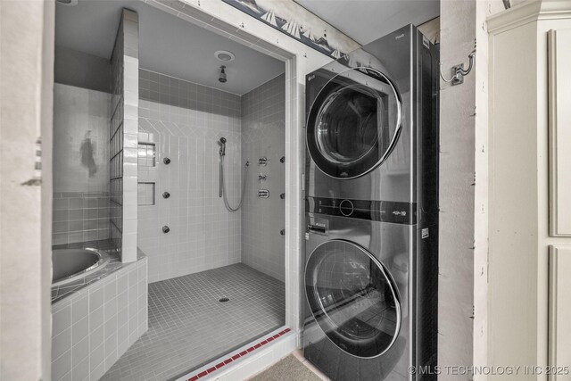 3112 Shore Dr, Grove, OK 74344 - bathroom featuring stacked washer and clothes dryer, tiled shower, and tile patterned floors