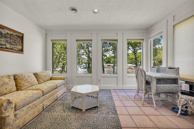 3112 Shore Dr, Grove, OK 74344 - sunroom / solarium featuring plenty of natural light, a textured ceiling, french doors, and tile patterned flooring