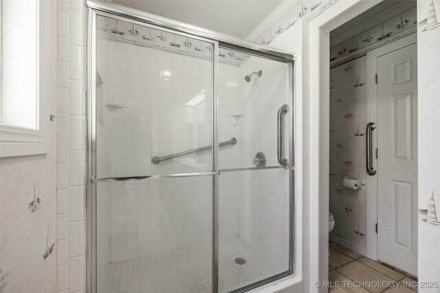 3112 Shore Dr, Grove, OK 74344 - full bath featuring toilet, a shower stall, and tile patterned flooring