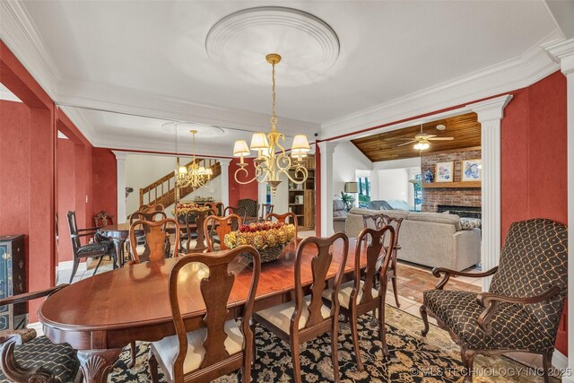 3112 Shore Dr, Grove, OK 74344 - dining space featuring decorative columns, a chandelier, ornamental molding, a fireplace, and ceiling fan