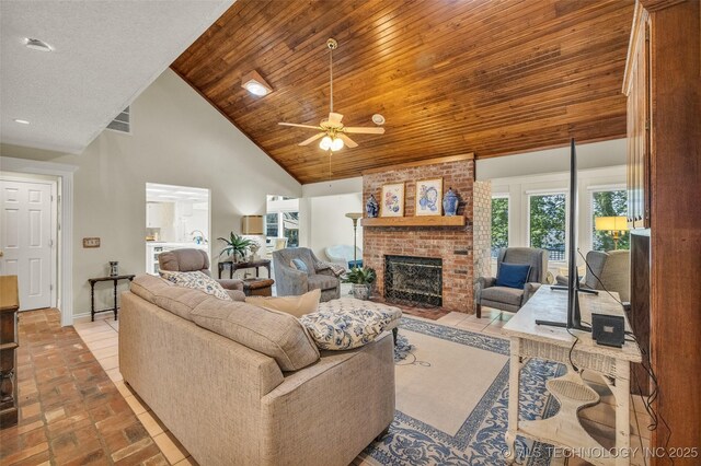 3112 Shore Dr, Grove, OK 74344 - living area featuring high vaulted ceiling, wood ceiling, a brick fireplace, a ceiling fan, and baseboards
